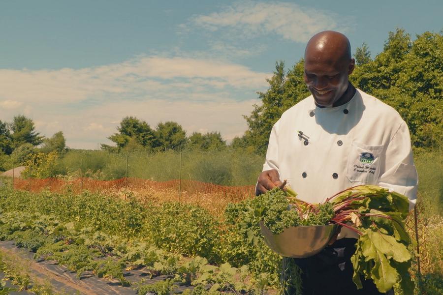 Collecting fresh greens from Elmhirst's own garden. Elmhirst's Resort is known for fresh farm to table cuisine. (Photo: Justen Soule)