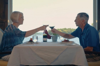 A couple enjoys Elmhirst's Resort's dining room overlooking Rice Lake. The menu emphasizes local and farm to table. (Photo: Justen Soule)