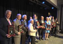 This year's honorees and their representatives: Peter Duffus, John Bowes, Elwood Jones, Mary McGee, Catia and Mike Skinner, Susan and Darrell Drain, Rhonda Barnet, Eleanor and Carl Young and Shelley and David Black. (Photo: Eva Fisher / kawarthaNOW.com)
