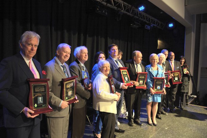 This year's honorees and their representatives: Peter Duffus, John Bowes, Elwood Jones, Mary McGee, Catia and Mike Skinner, Susan and Darrell Drain, Rhonda Barnet, Eleanor and Carl Young and Shelley and David Black. (Photo: Eva Fisher / kawarthaNOW.com)
