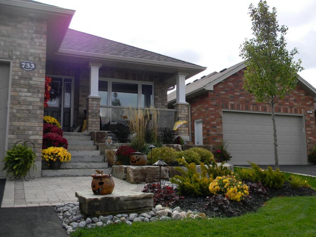 This fall entryway showcases the design value and utility of armour stone, a great slope stabilizer of seat. (Photo: Cavan Hills Landscaping)