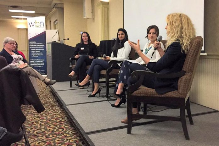 Writer Jeanne Pengelly (left) listens during the "Watch Out World" panel discussion at the May 3rd meeting of the Women's Business Network of Peterborough (WBN) as Chimp Treats owner Brooke Hammer (right) speaks, alongside fellow panelists Jane Zima (second from right) and Sana Virgji with moderator and WBN director Paula Kehoe. (Photo: Rose Terry / Innovation Cluster)