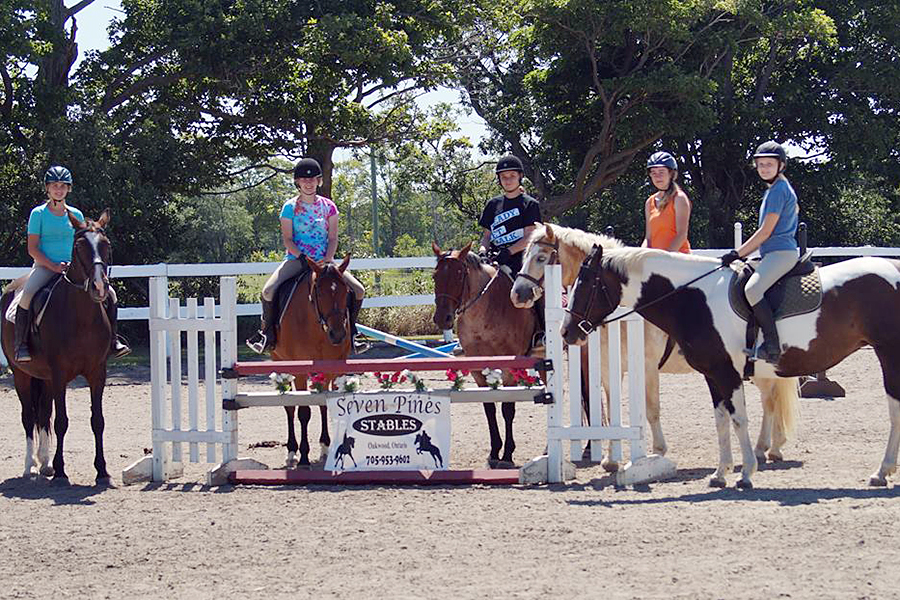 For the more experienced riders, athleticism is the focus, where campers improve their skills in advanced disciplines, like jumping and dressage. (Photo: Heather Leach / Seven Pines Stables)