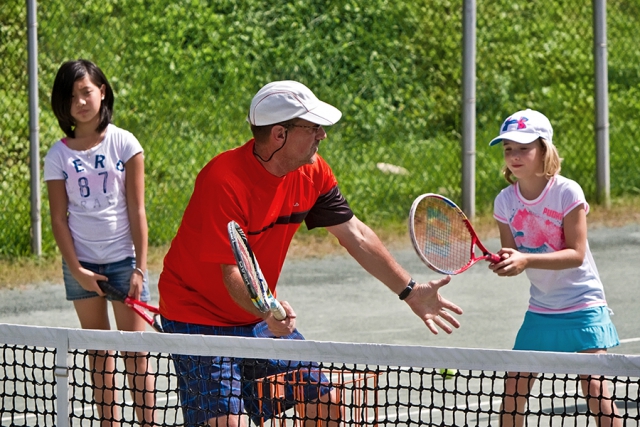 At Junior Tennis Camp, campers learn develop hand-eye coordination, basic stroke skills, and the fun of game play, all at the Quaker Park Tennis Club. (Photo: City of Peterborough Recreation Division)