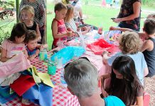 One way to make your kids' parties greener this summer is to nix the loot bags and involve your little partiers in a take-home craft instead. There will be less waste from individually packaged treats, less cost, and a lot more fun. Here children make take-home lanterns at last year’s GreenUP Ecology Park Family Night. (Photo: GreenUP)