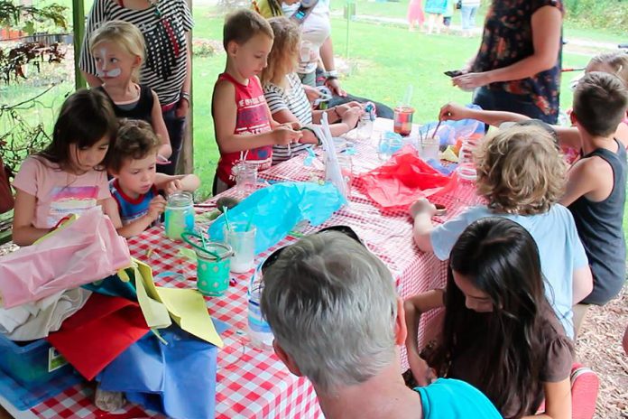 One way to make your kids' parties greener this summer is to nix the loot bags and involve your little partiers in a take-home craft instead. There will be less waste from individually packaged treats, less cost, and a lot more fun. Here children make take-home lanterns at last year’s GreenUP Ecology Park Family Night. (Photo: GreenUP)