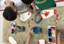 Students from Peterborough's St. Paul and Immaculate Conception Catholic Elementary Schools working on "Canada Walking Forward", an art exhibit of 150 clay footprints of the students' own feet decorated to answer the question "What does Canada mean to you?". The exhibit is one of four student art exhibits that will be on display during Peterborough's four-day Canada 150 celebration from June 29 to July 2. (Photo: Canada 150th Committee)