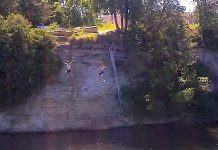 Two boys jumping off of a cliff in Fenelon Falls. 15-year-old boy Harley Broome of Fenelon Falls drowned Saturday afternoon after swimming with friends on the Sturgeon Lake side of the Fenelon Falls locks. (Photo: xorozzzi / YouTube)