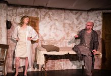 In "Frenzy for Two, or More", Kate Story and Dan Smith portray a couple who are trapped in their home and have a ridiculous argument about a tortoise and a snail while a war rages outside. (Photo: Andy Carroll)