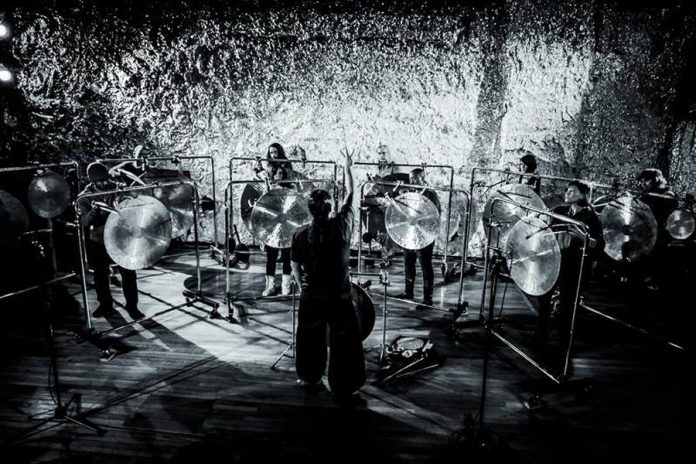 The National Gong Orchestra comprises 14 local musicians who learn to play bowed gongs before giving a public performance conducted by composer and percussionist Tatsuya Nakatani. (Photo: Peter Gannushkin)