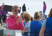 Gina Lee encouraging paddlers during a pre-race practice for Peterborough's Dragon Boat Festival. Among other things, Lee is responsible for organizing dozens of teams and practice times. (Photo: Jessica Fleury)