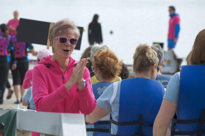 Gina Lee encouraging paddlers during a pre-race practice for Peterborough's Dragon Boat Festival. Among other things, Lee is responsible for organizing dozens of teams and practice times. (Photo: Jessica Fleury)
