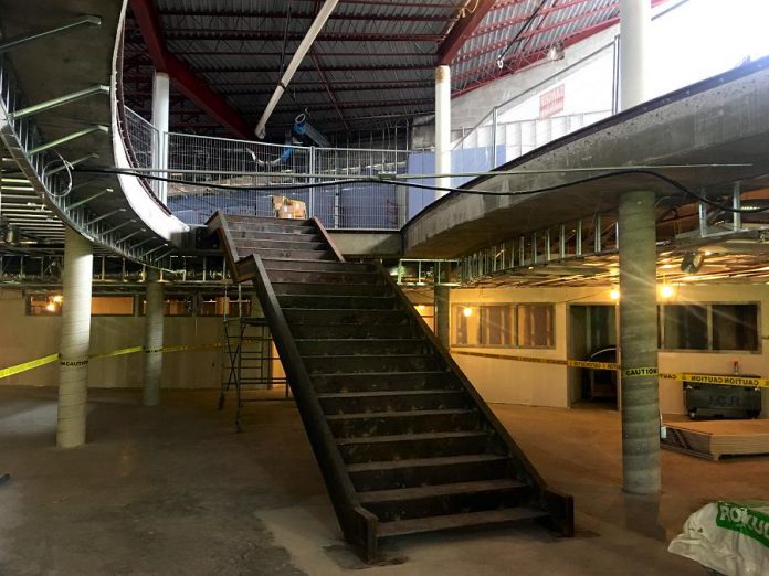 The most prominent new interior feature of the Peterborough Public Library's $12 million expansion and retrofit is the large, naturally lit central staircase connecting the main level with the expanded lower level children's programming area. (Photo: Peterborough Public Library)