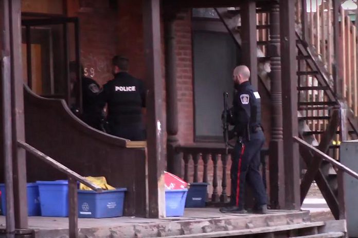 Peterborough police at a Water Street rooming house in March 2017, following an incident where a man was shot multiple times. (Photo: Peterborough Scanner Feed / YouTube)