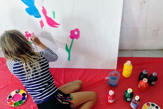 A young artist makes art in the studio. The Art Gallery of Peterborough offers many opportunities for campers to have fun drawing, painting, and printing while at camp. (Photo: Art Gallery of Peterborough)