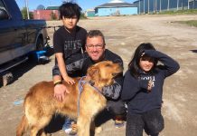 18 dogs and cats from Big Trout Lake First Nation north of Thunder Bay will be available for adoption in Peterborough. Pictured is Jeff Day, Executive Director of Community Futures of Peterborough, who travelled to the community to participate in a spay-neuter clinic. (Photo: Peterborough Humane Society)