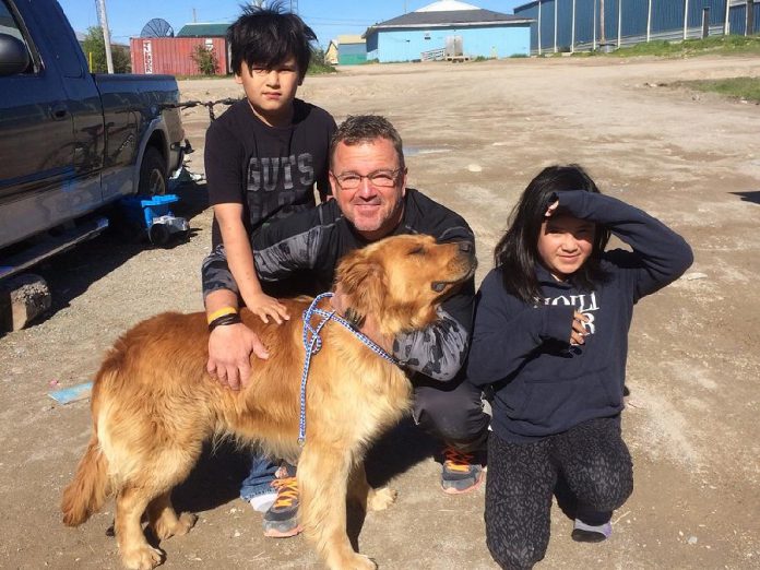 18 dogs and cats from Big Trout Lake First Nation north of Thunder Bay will be available for adoption in Peterborough. Pictured is Jeff Day, Executive Director of Community Futures of Peterborough, who travelled to the community to participate in a spay-neuter clinic. (Photo: Peterborough Humane Society)