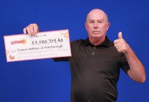 Francis Hobbins of Peterborough with his cheque for $3,280,729.40. (Photo: Ontario Lottery and Gaming)