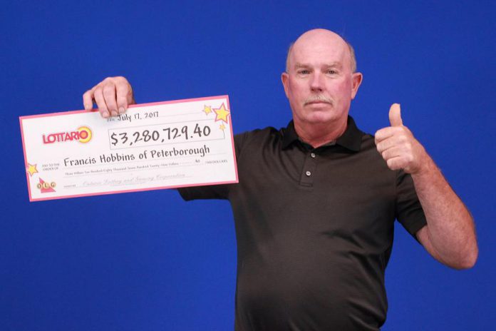 Francis Hobbins of Peterborough with his cheque for $3,280,729.40. (Photo: Ontario Lottery and Gaming)