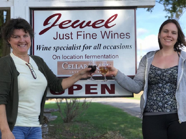 Rachel Bleakley (right) and former owner Jordon Hale toast to a new future at Jewel Just Fine Wines. (Photo: Jewel Just Fine Wines)