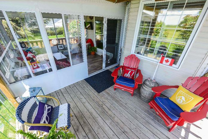 The Hogan's Lifestyle Home Products glass-walled sunroom is located directly off their back deck, which came in handy last year when rain fell during their Canada Day party. (Photo: Lifestyle Home Products)