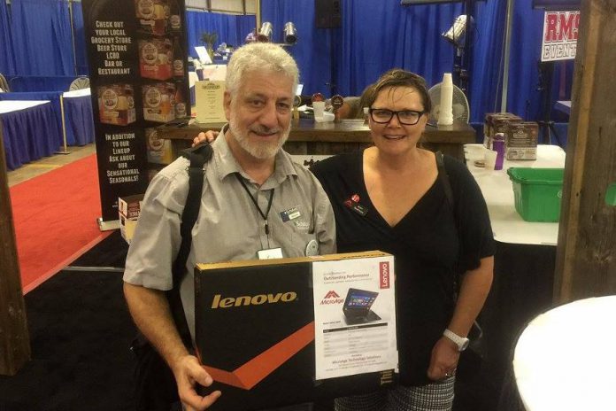 At this year's Love Local Expo, MicroAge will again be giving away a grand prize of a Lenovo laptop computer. Pictured is last year's winner, Brian Nashman, owner of Scholars Education Centre in Peterborough, with Amy Simpson, owner of MicroAge Peterborough.