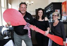 Peterborough DBIA Executive Director Terry Gueil and United Way of Peterborough & District Development Officer Erica Richmond (right) with Amanda Menard, owner of Amandala's, one of the 32 restaurants in downtown Peterborough participating in the Paint The Town Red fundraiser. (Photo: United Way of Peterborough & District)