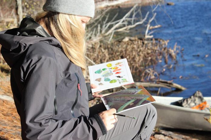 A participant in a plein air painting and paddling workshop held earlier this April. You'll be wearing summer clothes for one of the four experiences during July, August, and September offered by The Canadian Canoe Museum and The Land Canadian Adventures. (Photo courtesy of The Canadian Canoe Museum / The Land Canadian Adventures)