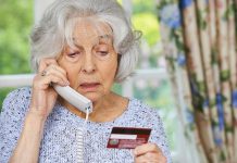 Elderly woman responding to phone scam