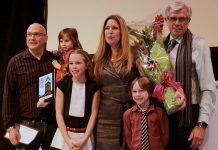 Tina Bromley (centre) her family after winning the Peterborough DBIA's Win This Space contest in February 2017. CBC Ontario Morning will interview Bromely after the Town of Dryden recently launched its own Win This Space competition. (Photo: Peterborough DBIA)