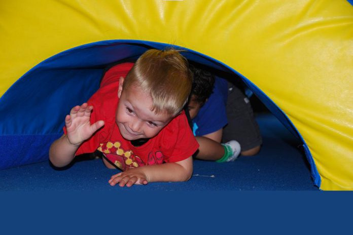 Gymnastics is a great way for kids to experiment with their bodies in a controlled environment. (Photo courtesy of Champions Gymnastics)