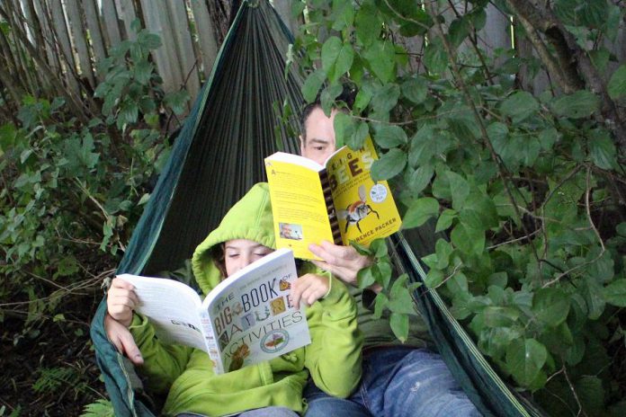 Along with every relaxing afternoon in a hammock, comes a book. This summer, spend some quality outdoor time at the cottage, beach, or in the backyard with a green-themed book such as The Big Book of Nature Activities by Drew Monkman and Jacob Rodenburg or Keeping the Bees by Laurence Packer. (Photo: Karen Halley)