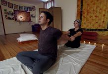 Jonny Harris, host of the CBC Television series Still Standing, receives a Thai massage from Caroline Owen of Wavelengths Yoga Studio in Norwood. The episode will be broadcast on August 22, 2017 and then will be available to view online. (Photo: CBC Television)
