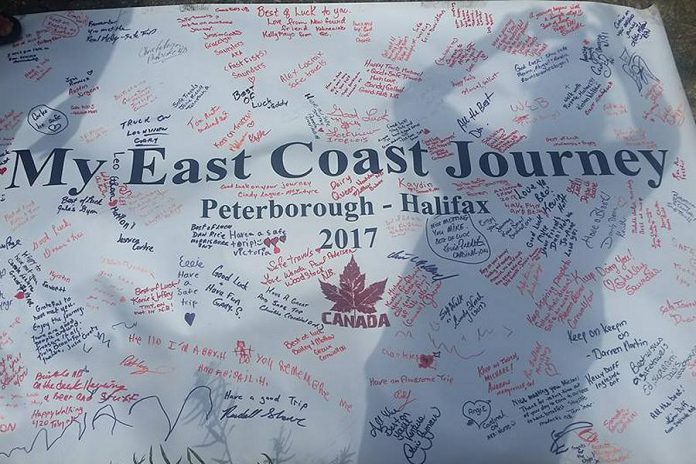 The banner is now filled with messages and notes from people Sutherland has met. (Photo: Karrie Hill / Facebook)