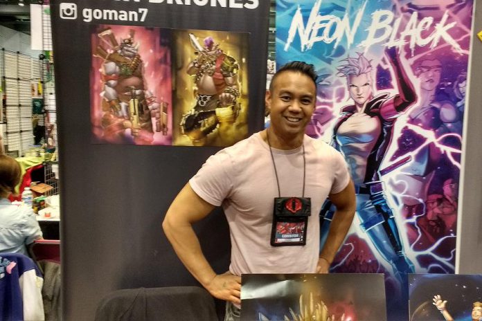 Comic book artist and storyteller Kevin Briones, creator of the independent comic series "Neon Black", at the Toronto Fan Expo. Raised in Peterborough, Kevin will come back home to present his art at the Peterborough Comic Con at the Evinrude Centre on September 24, 2017. (Photo: Sam Tweedle / kawarthaNOW)