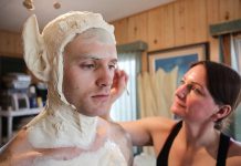 Rhonda Causton of Omemee, owner of Reel Twisted FX, works on actor Jarrett Siddall during production of the short horror film Latched, which premieres at the Toronto International Film Festival on September 10. (Photo: Bokeh Collective)