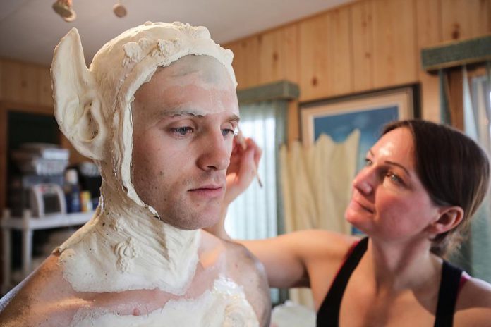 Rhonda Causton of Omemee, owner of Reel Twisted FX, works on actor Jarrett Siddall during production of the short horror film Latched, which premieres at the Toronto International Film Festival on September 10. (Photo: Bokeh Collective)