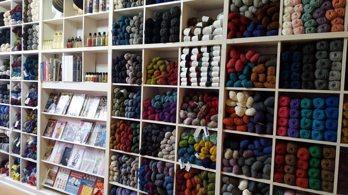 The "wall of yarn" at the newly renovated Needles in the Hay in downtown Peterborough. Owner Deanna Guttman is offering five wools from Brookyn Tweed in various weights and colours: 20 colours of Shelter, Loft, and Arbor, and seven colours in the Quarry and Vale lines. (Photo: Deanna Guttman)  