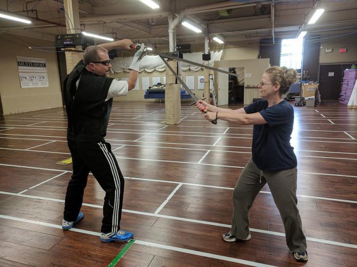 Peterborough Multi-Sport Club owners and coaches Scott Nichols and Michelle Curran enjoy a friendly spar with longswords. All of the techniques used at the club's practices are based on historical European martial arts and is supported by strength, speed and assertive execution. (Photo: Peterborough Multi-Sport Club)