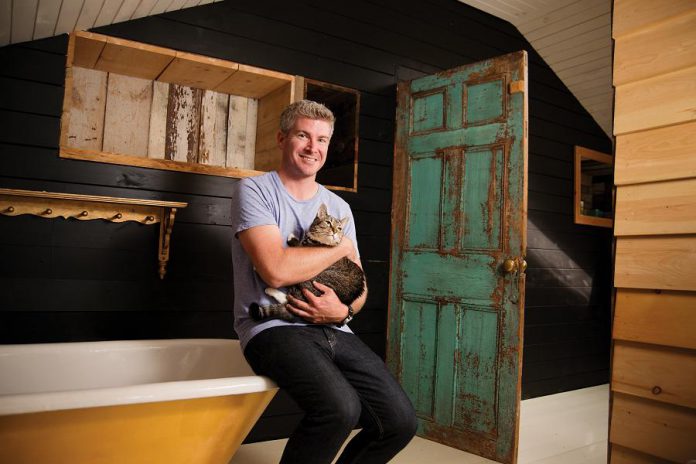 TSN anchor Dan O'Toole poses with his temporarily calm rescue cat Vira for 'Shelter Shots', the Peterborough Humane Society's fundraising calendar. (Photo: Mike Taylor)