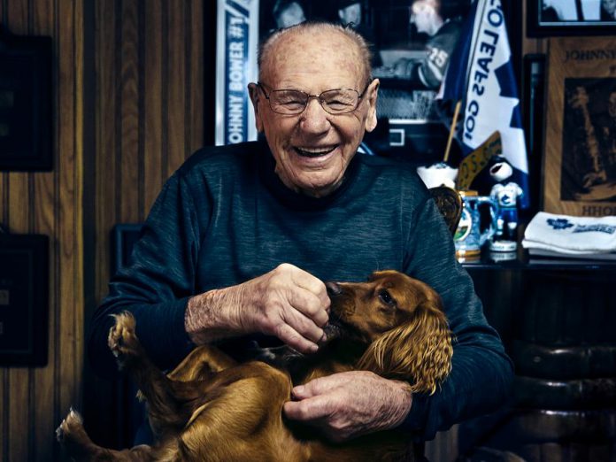 Toronto Maple Leaf goaltending legend Johnny Bower with Jasper, a rescue dog owned by photographer Peter Nguyen, in a photo for 'Shelter Shots', the Peterborough Humane Society's fundraising calendar. (Photo: Peter Nguyen)