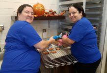 Peterborough YMCA staff helping prepare Smile Cookies at Tim Hortons in Lakefield. The $1 cookies are available from September 11 to 17 at Tim Hortons restaurants in Peterborough, Bridgenorth, and Lakefield with all proceeds going to support the YMCA Strong Kids campaign. (Photo: YMCA of Peterborough / Twitter)