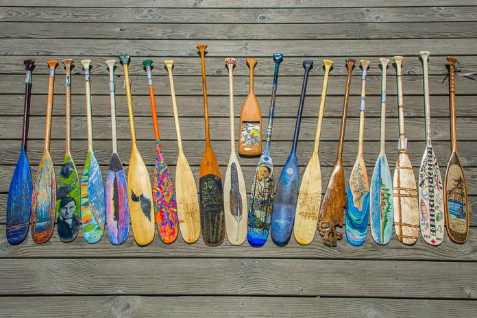A few of the more than 170 paddles submitted to Algonquin Outfitters for their Tom Thomson Paddle Art Contest. The paddles will be auctioned off with proceeds going to support local arts. (Photo: Algonquin Outfitters)
