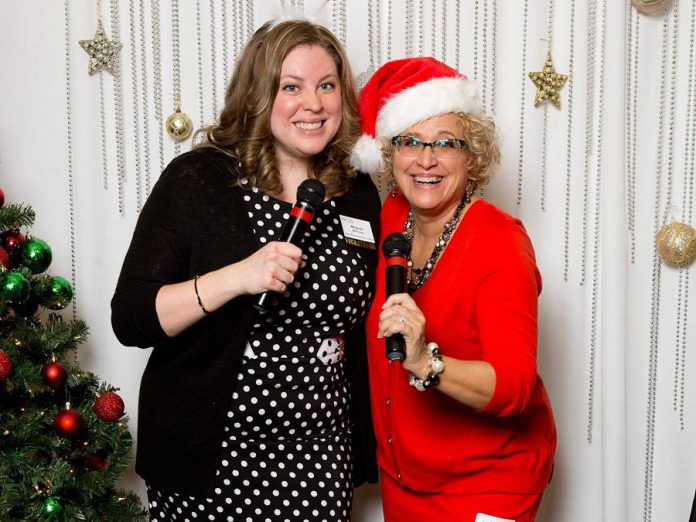 Susan Dunkley (right) is a long-time member of the Women's Business Network of Peterborough and often called upon to lead (and emcee) the organization's fundraising events. Here she is with WBN member and co-emcee Meghan Moloney at the network's Christmas Gala, an annual event that raises funds for YWCA Crossroads Shelter. (Photo: WBN)