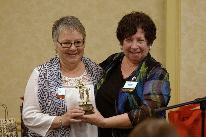 Maureen Tavener presents a "keeper version" of the 2017 Member of the Year Award to Louise Racine at the May 2017 WBN meeting. This was the second year in a row that Louise received this award. (Photo: Paula Kehoe / WBN)