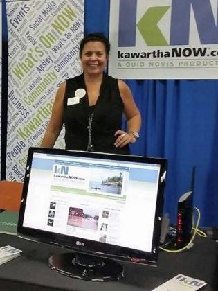 Jeannine Taylor promoting kawarthaNOW.com at a Peterborough Chamber of Commerce trade show in 2013.