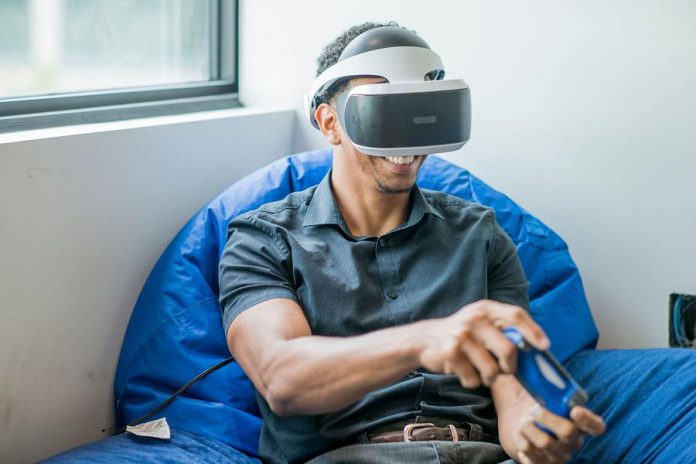 The Cube features a virtual reality development studio. Here a client works in the Virtual and Augmented Reality Zone of the incubator. 