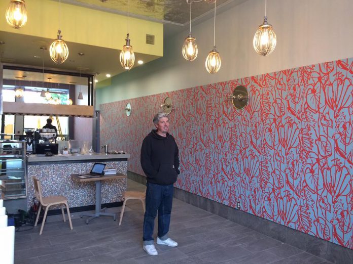 The Night Kitchen's new location is decorated with lights made by owner Tim Weatherup from mixer attachments. (Photo: Eva Fisher)