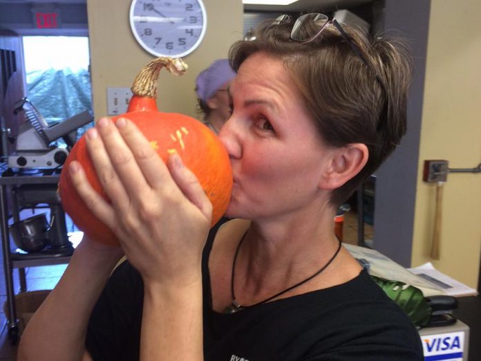 The hokkaido squash, also known as Uchiki Kuri, is a favourite at By the Bridge and at Chick-abiddy Acres. Here Bridget Cullen shows her love. (Photo: Eva Fisher)