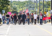 While the vast majority of participants at the anti-hate rally in downtown Peterborough on September 30, 2017 were local residents who protested peacefully, some of the protestors disguised their identities and some came from outside the area, including 22-year-old William October of Toronto who has been charged with assault and obstruct peace officer. (Photo: Linda McIlwain / kawarthaNOW.com)